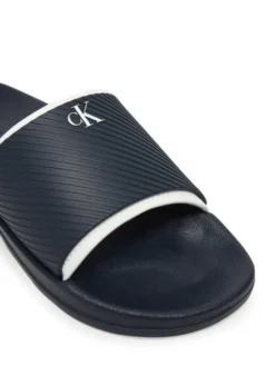 Calvin Klein Jeans Klapki Slide Rubber Neoprene Text YM0YM01234 Granatowy